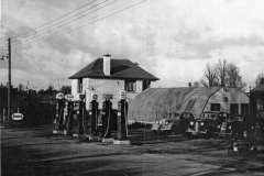 003680 Crouch's petrol pumps and garage, boy in pedal car is Stephen Crouch c1950